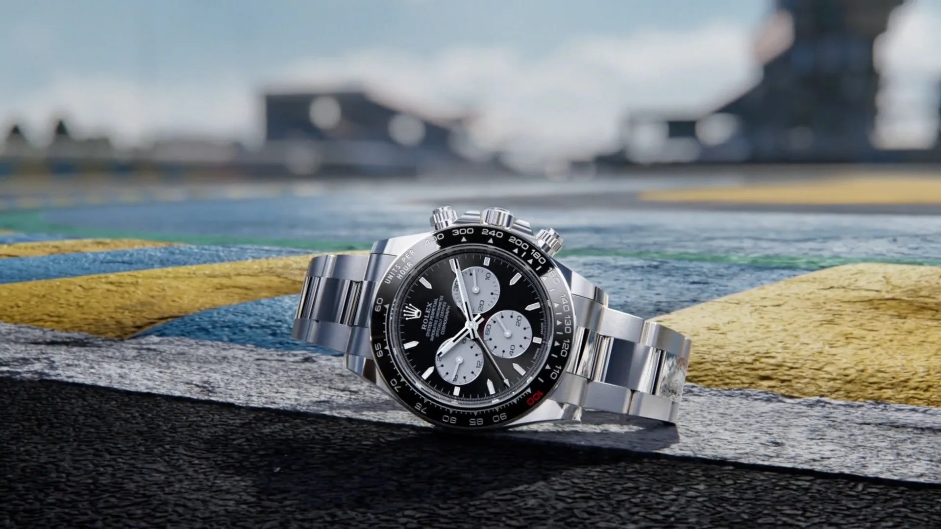 Rolex Cosmograph Daytona Le Mans 126529LN-0001 in white gold resting on a racetrack kerb